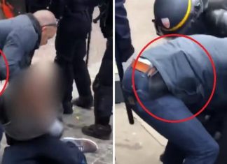 Photo : Benalla pose avec son arme (Détail) Photo : Benalla pose avec son arme